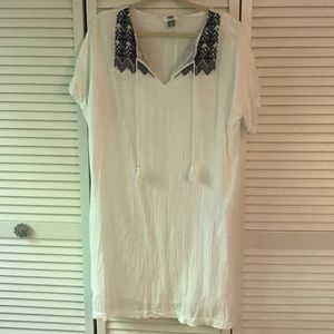 White dress with blue embroidery